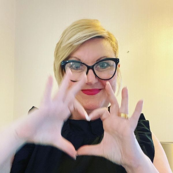 Jo Sinclair of podcast Talk-in Fertility - Jo Sinclair making a heart with her fingers